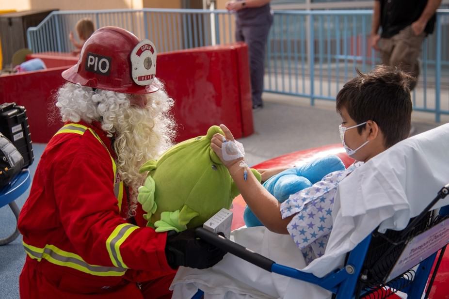 A boy receiving a gift from Santa